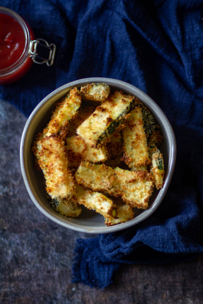 zucchini fries in a big black bowl