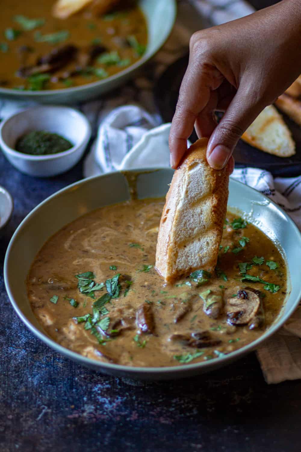 crusty bread dipped in Hungarian Mushroom Soup