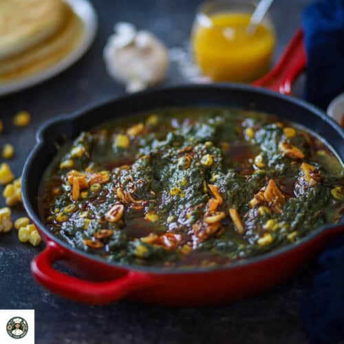 Imag eof palak corn recipe in a red cast iron skillet.