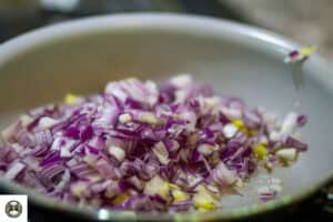 Saute the onions in a skillet for 2-3 minutes.