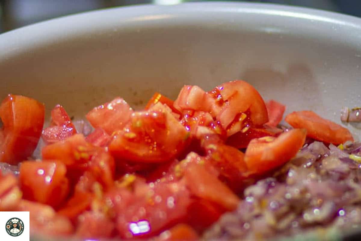 Add tomatoes in the skillet, once onions are cooked.