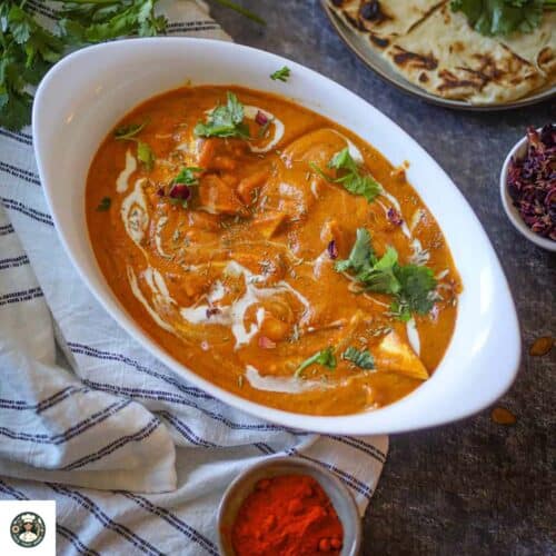 Overshot image of shahi paneer in a white bowl.
