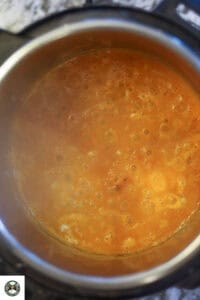 Image of pureed onion-tomato masala in the pot.