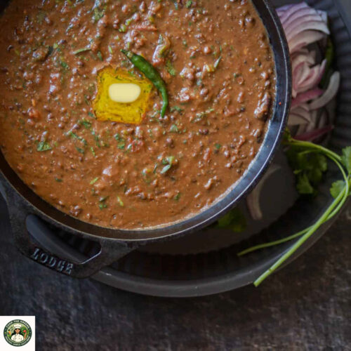 Close-up of creamy instant pot dal makhani with melted butter on top.