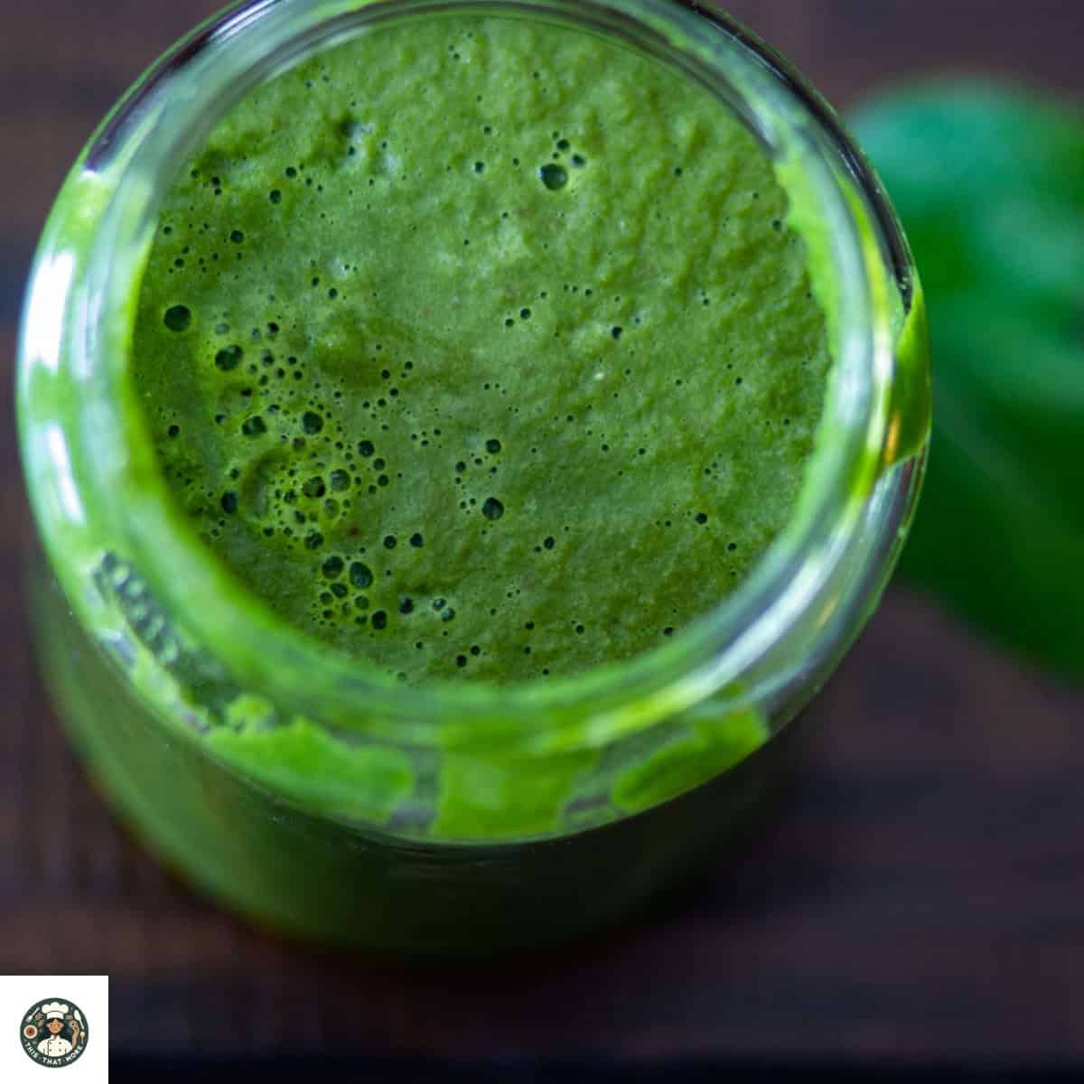 Overshot image of mason jar filled with green chutney.