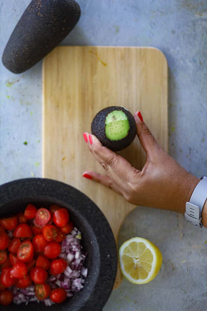 cut he top & bottom of avocado.