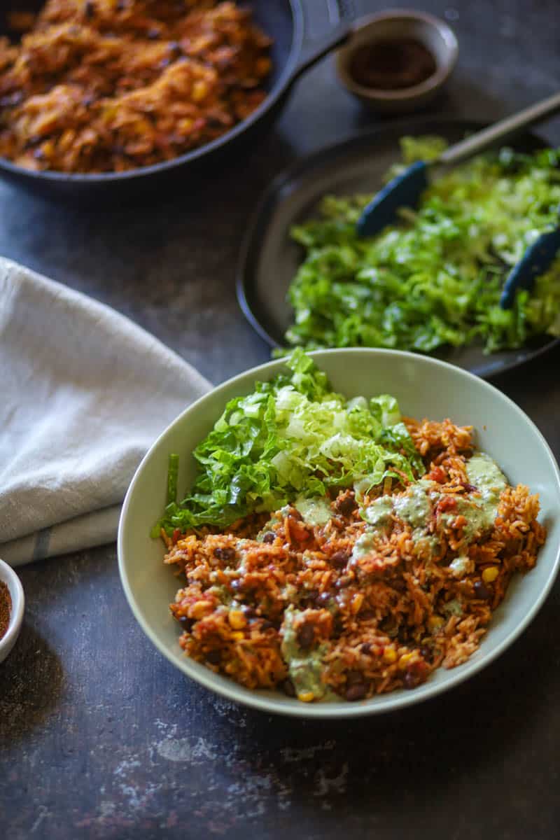 Instant Pot Vegan Burrito bowl served in a bowl with some lettuce.