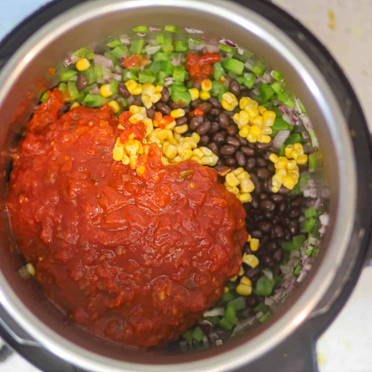 add black beans, salsa, and corns.