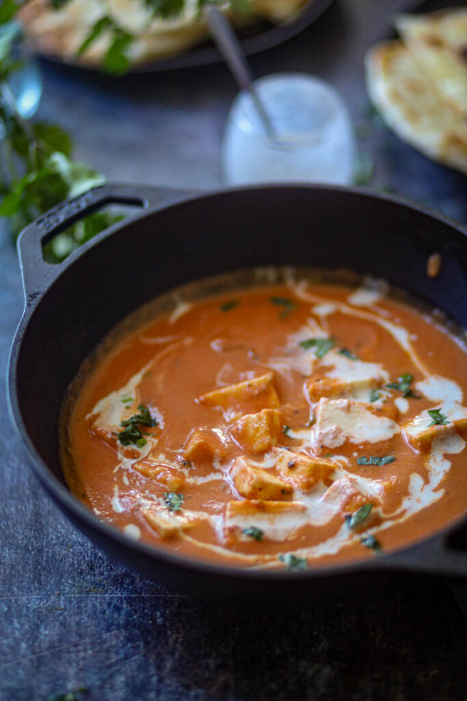 a big bowl of butter paneer masala.