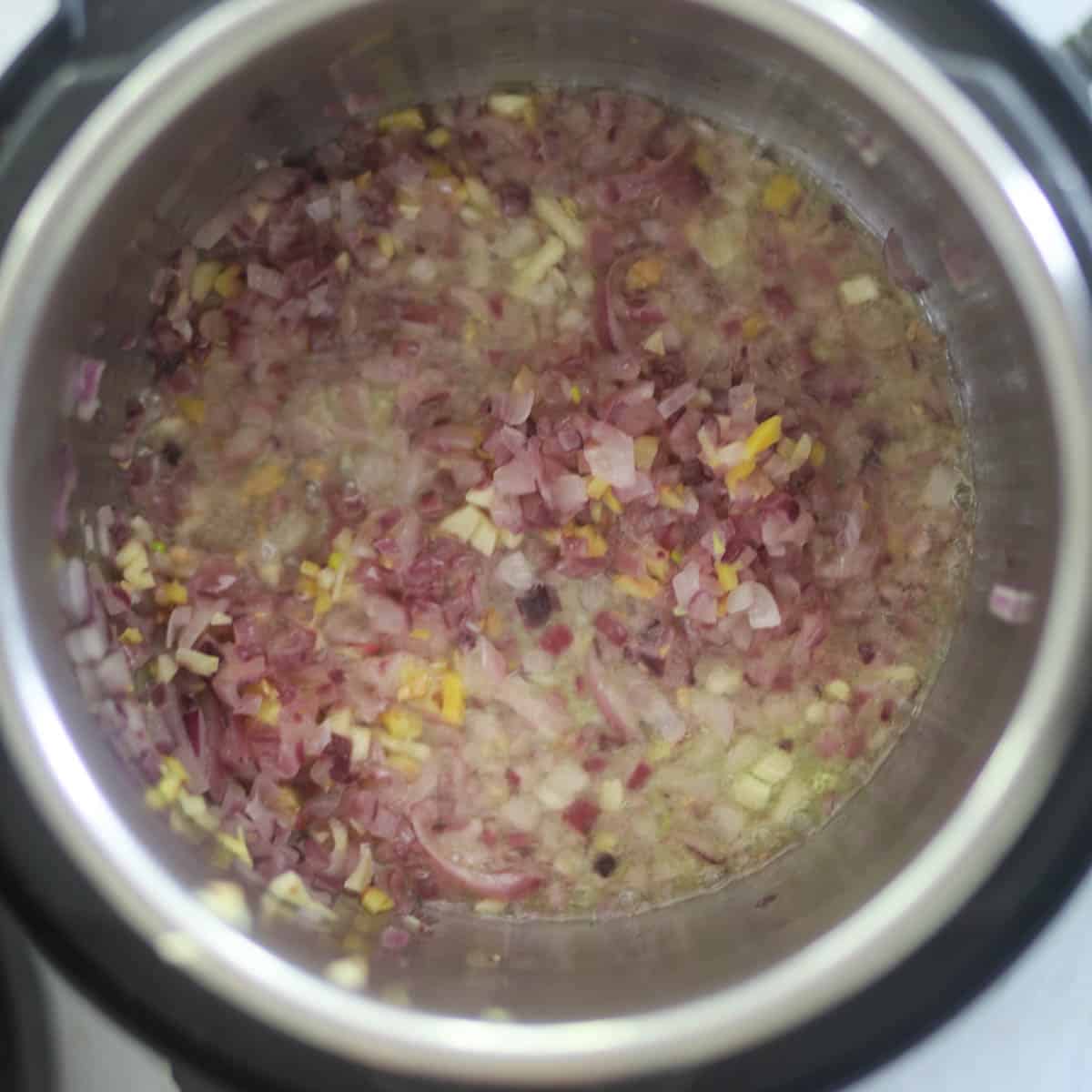 Fry onion until they start to change the color.