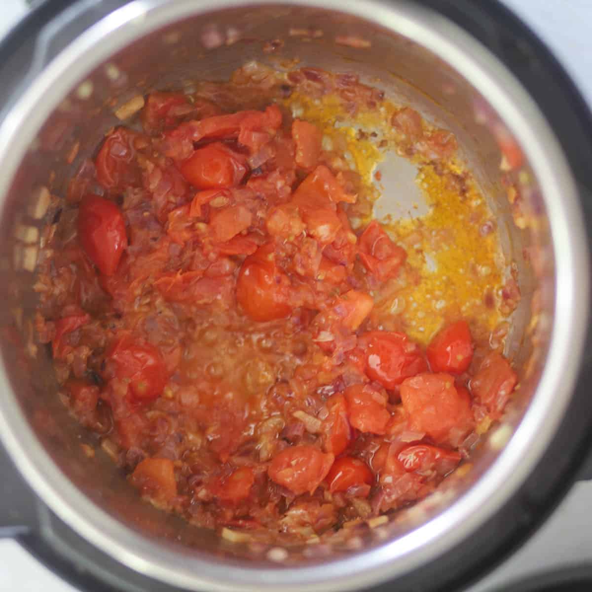 cook tomatoes until soft & mushy.