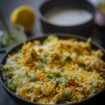 Paneer Biryani Recipe served in a black wok.