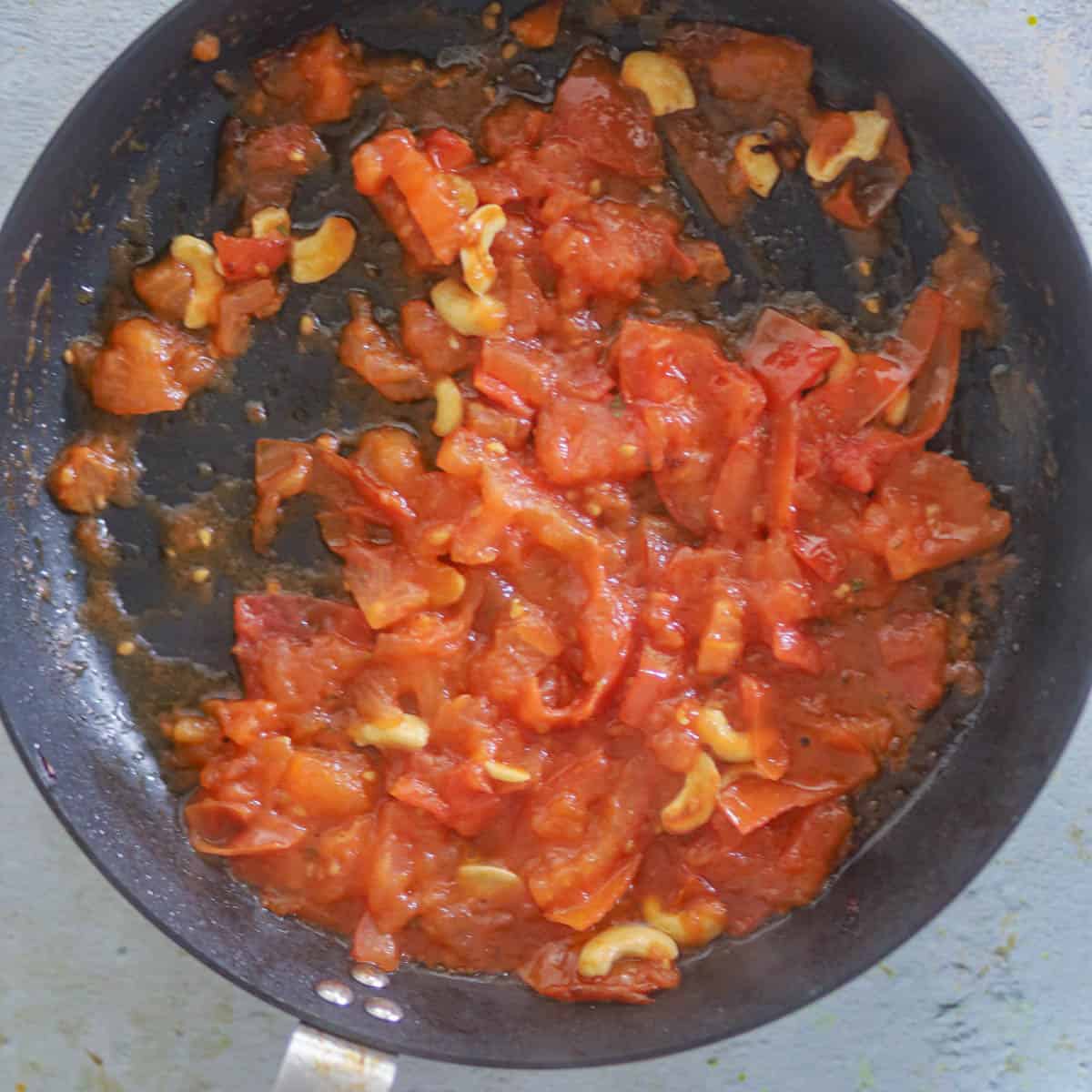 Cook tomatoes until they turn soft & mushy.