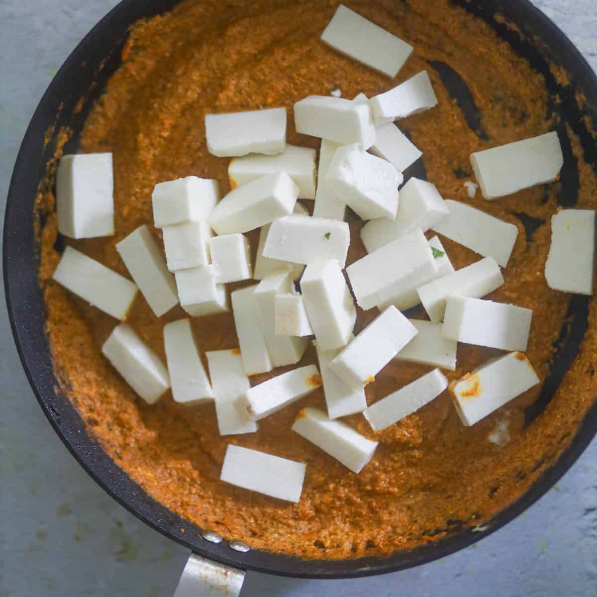 Add paneer cubes & mix.