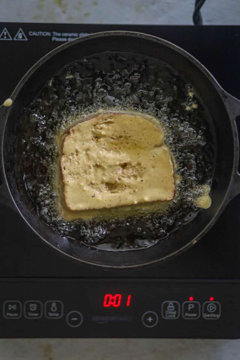 Dop the bread in the hot oil.