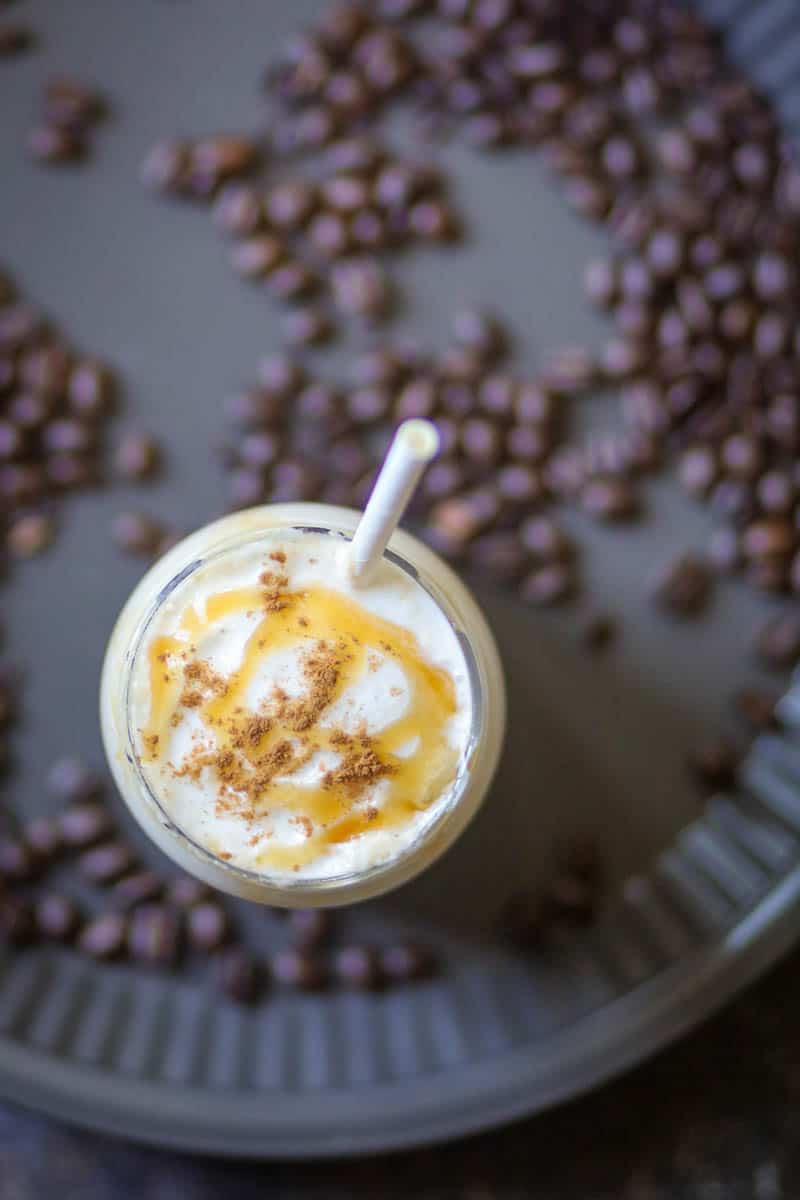 overshot of iced coffee with coffee beans.