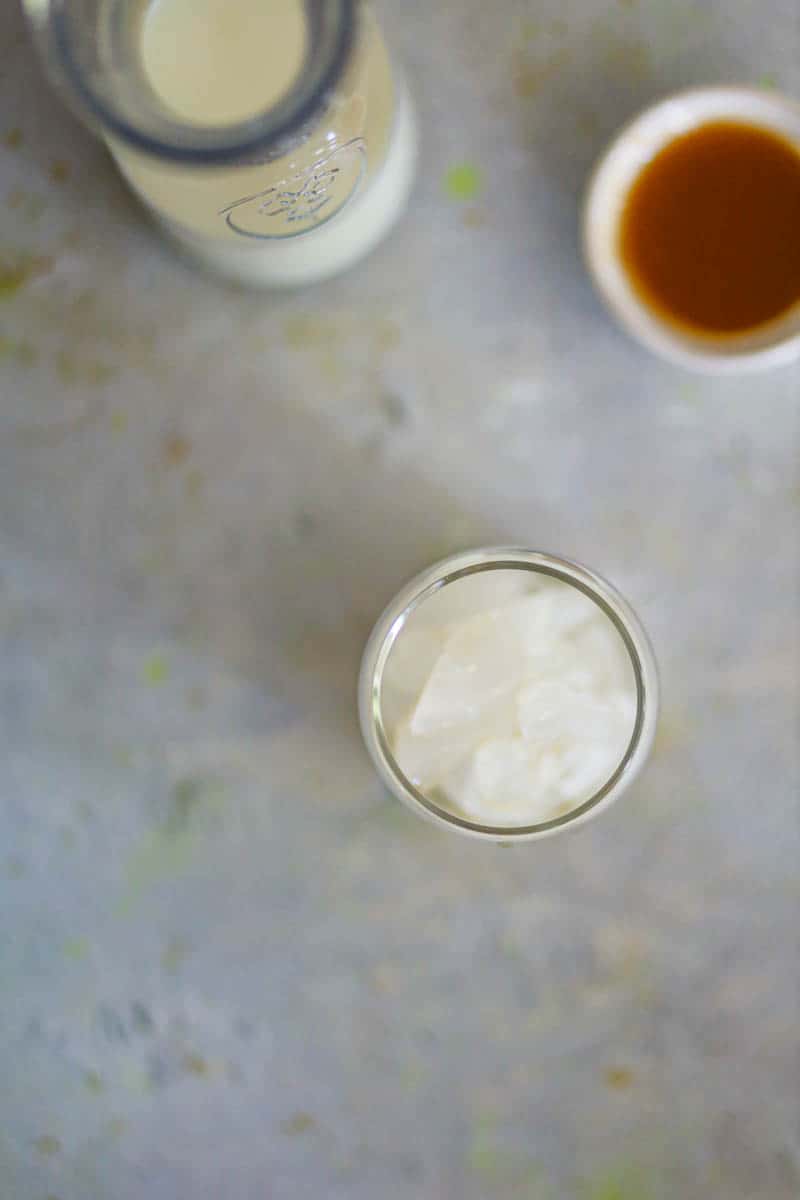 Add ice cubes in a tall glass.