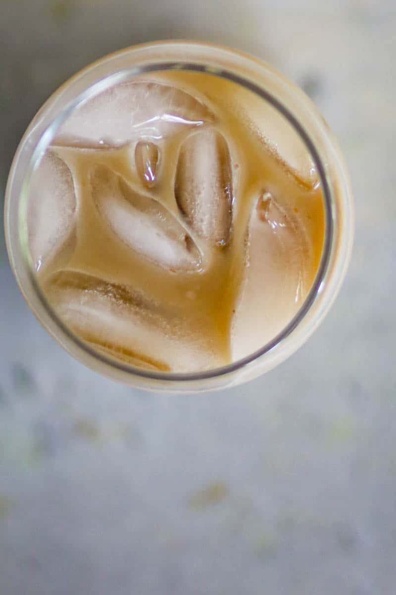 Caramel Iced Coffee in a glass with ice cubes.
