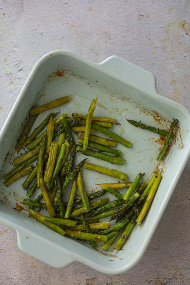 Bake the asparagus in oven until roasted.