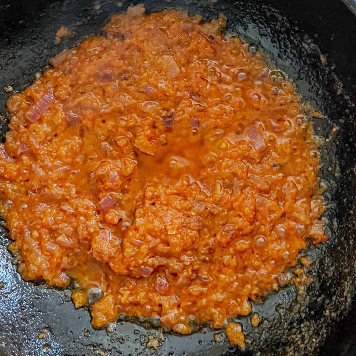 cook tomatoes until soft & mushy.