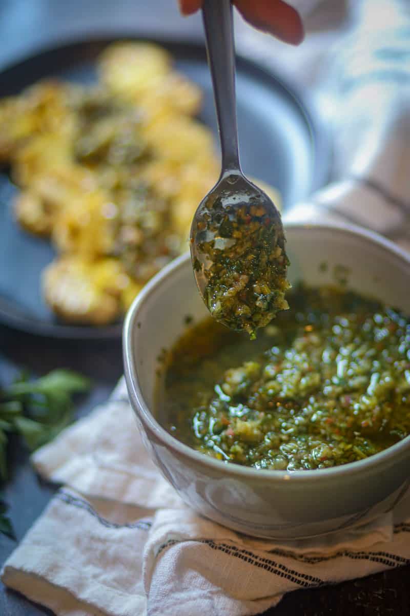 Spoonful of cilantro chimichurri sauce.