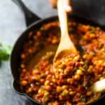 Vegan Shakshuka served in a black skillet.