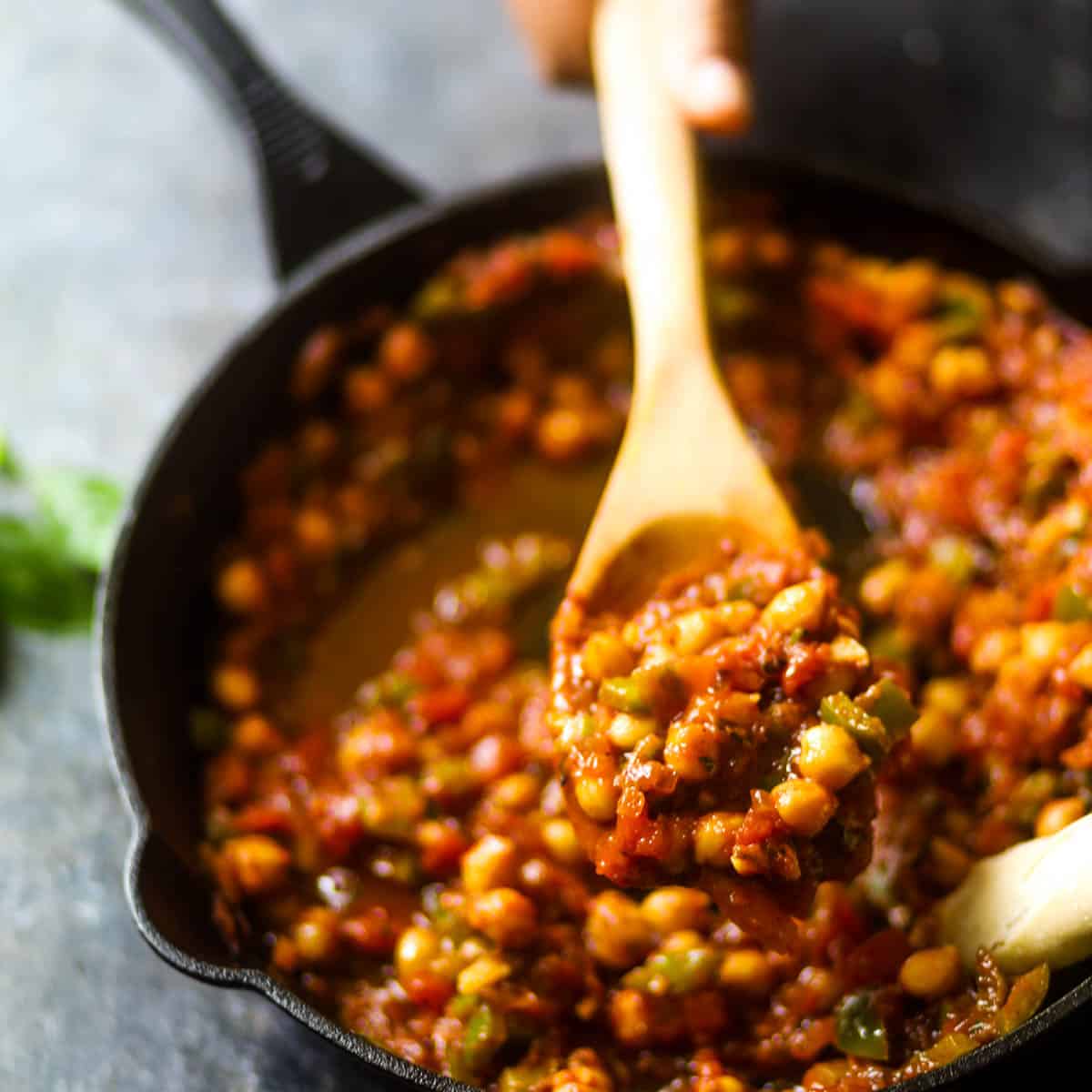 This Vegan Shakshuka with Chickpeas is an easy recipe and requires minimal ingredients. Chickpeas are added in delicious tomato sauce along with spices. It can be served in breakfast or brunch with crusty bread of your choice. #shakshuka #chickpeas #vegetarianrecipes #breakfast