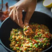 Taking a bite of roti and baingan bharta.