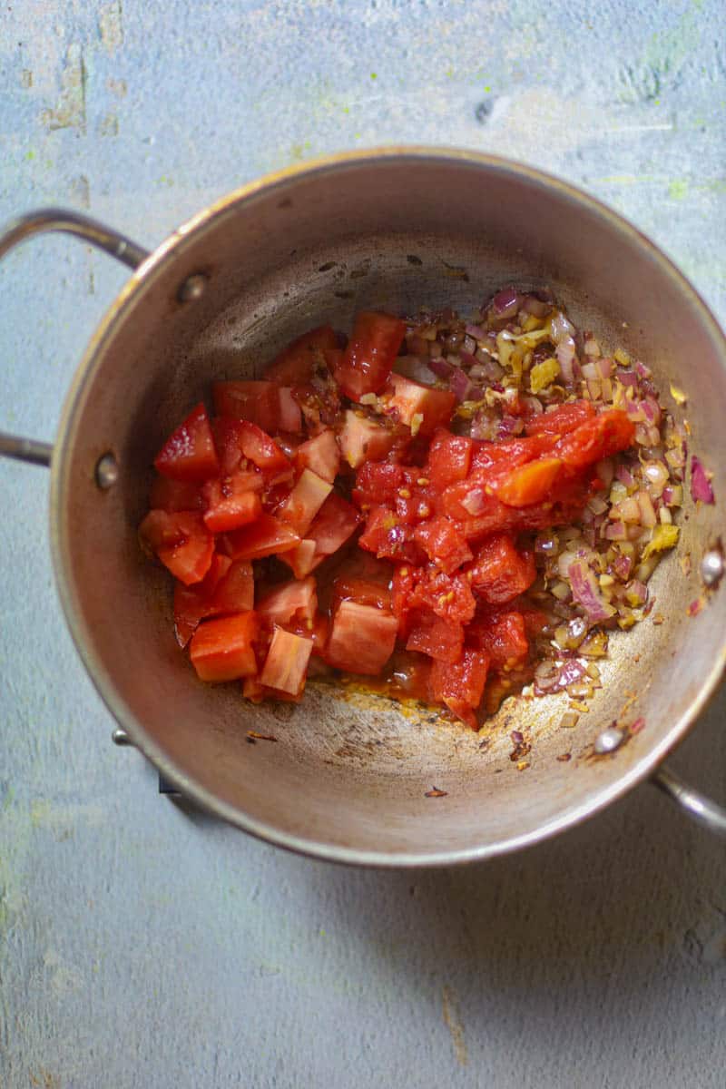 Add chopped tomatoes.