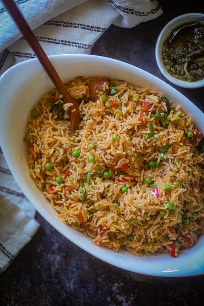 A bowl full of chimichurri sauce.