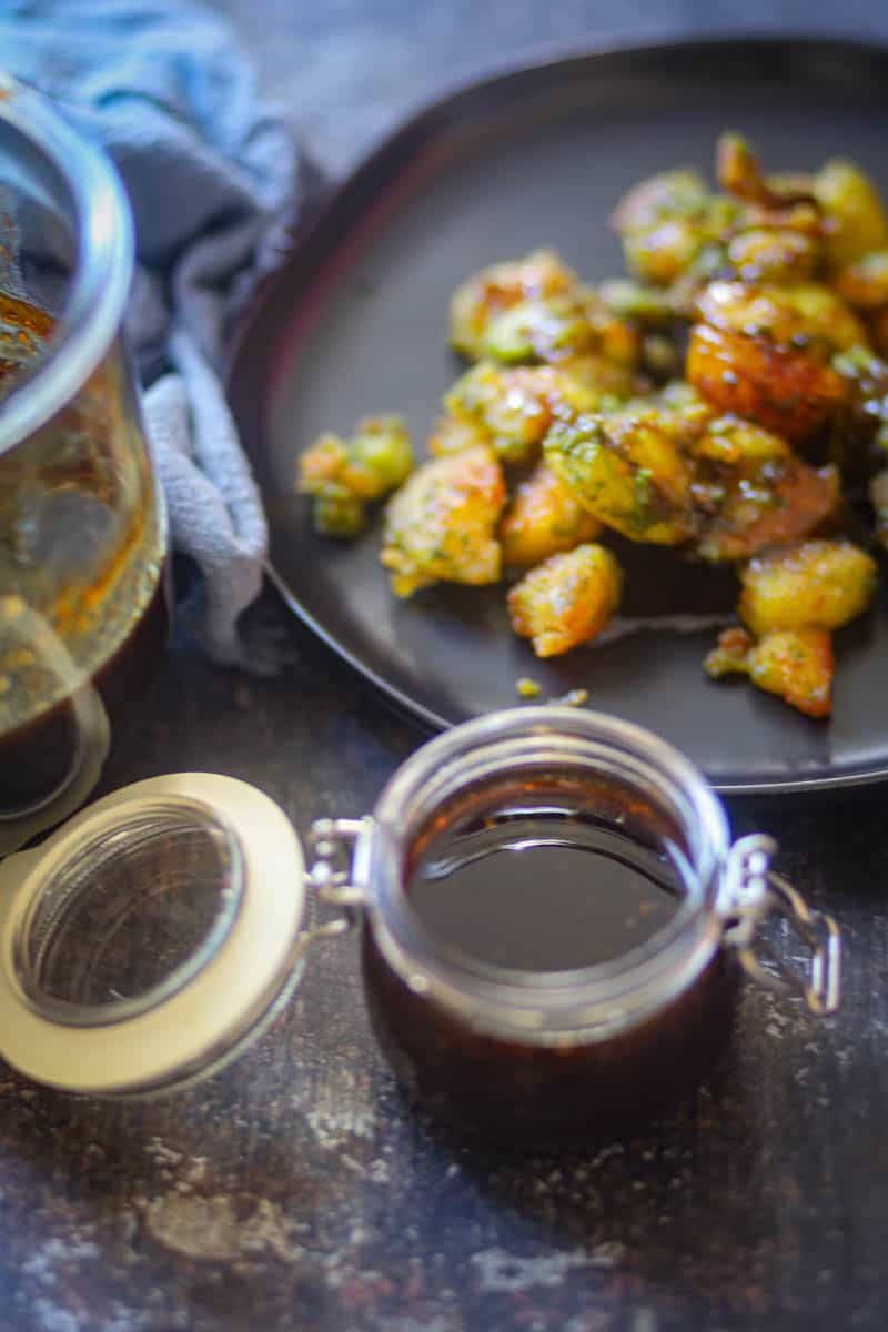Serving imli chutney with aloo chaat,