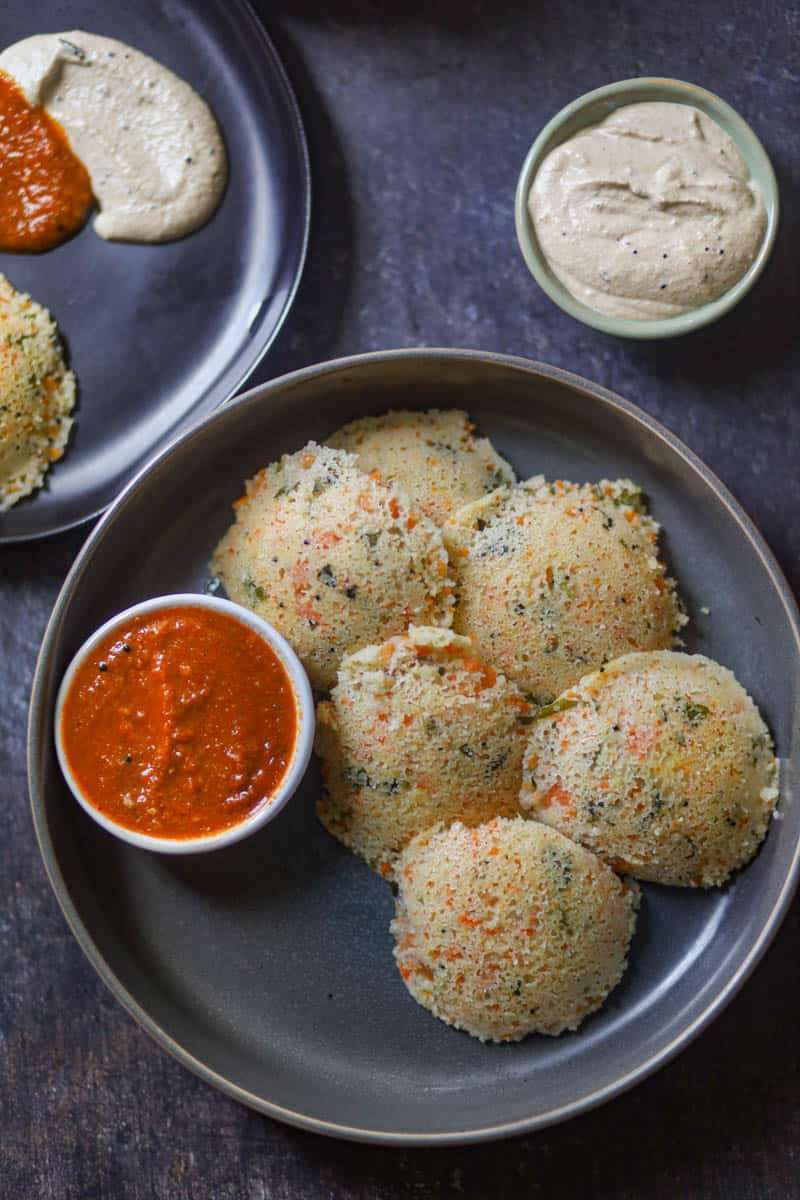 Serve rava idli with tomato garlic chutney.
