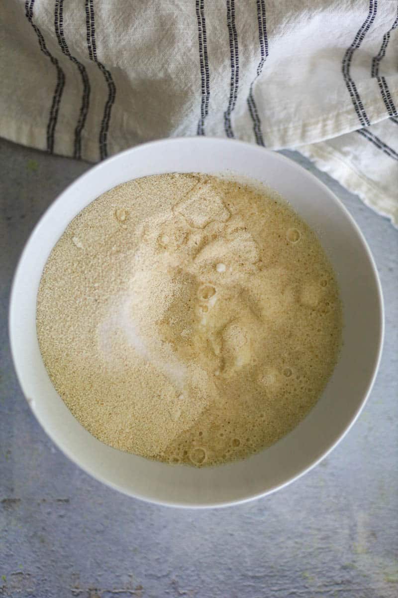 Add rava, yogurt, and water in a bowl.