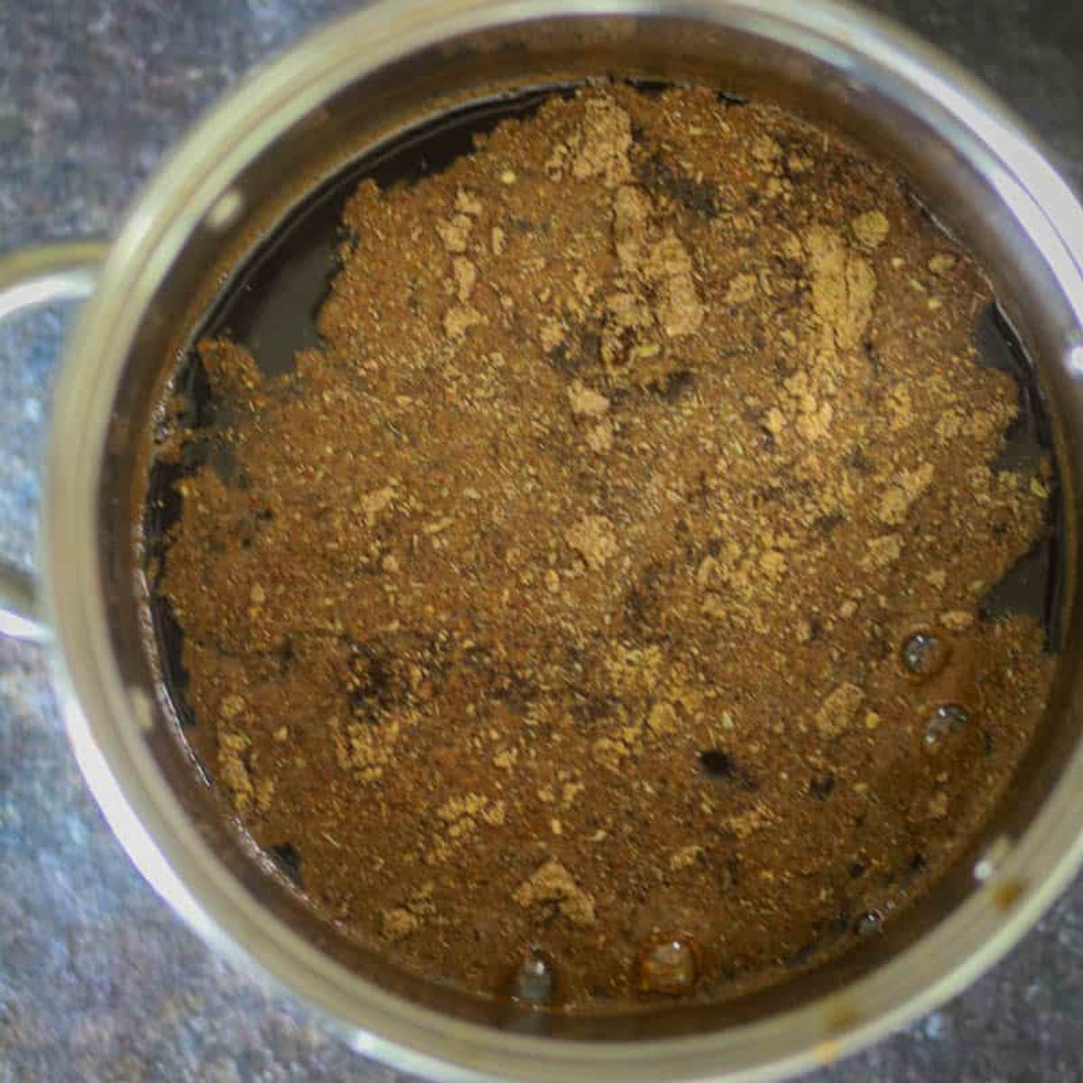 Spices added to tamarind chutney.