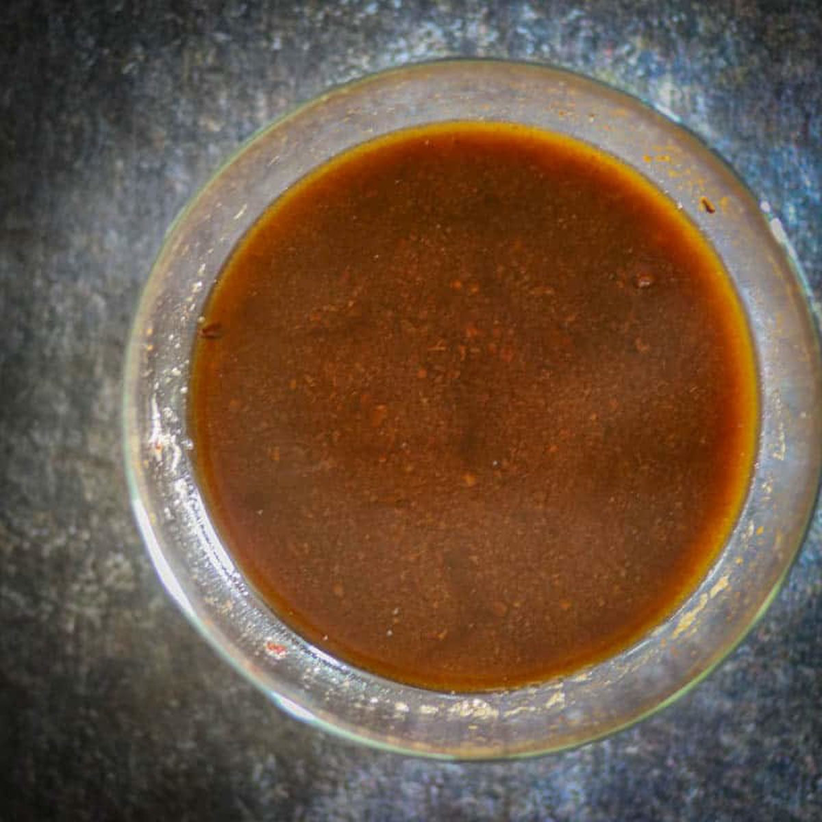 Tamarind pulp cooking in a saucepan.