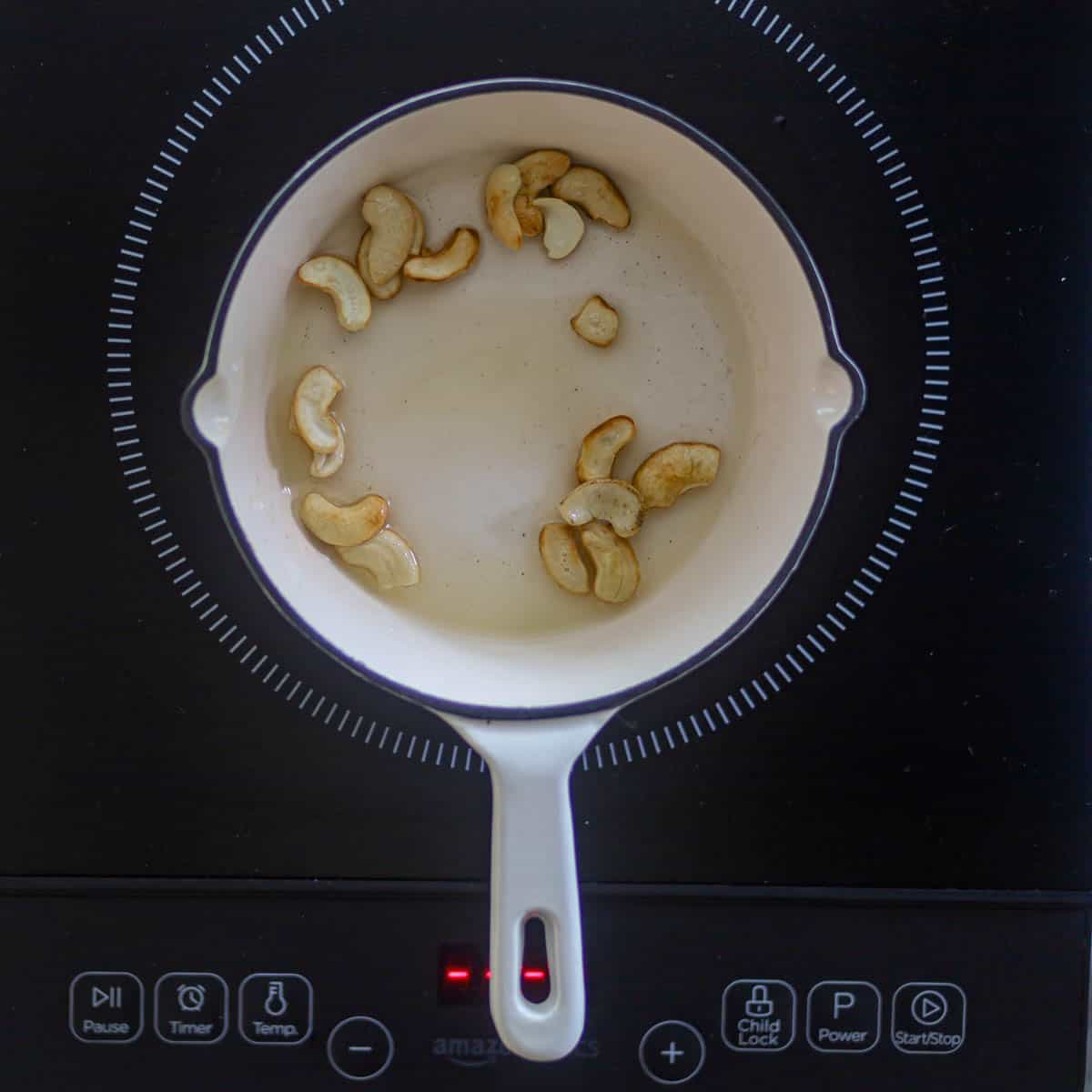 Fry cashews until golden.