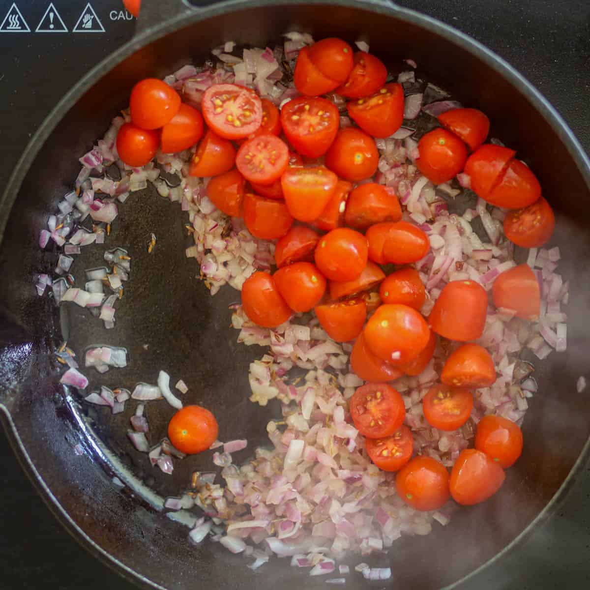 Add tomatoes and cook until soft & mushy.