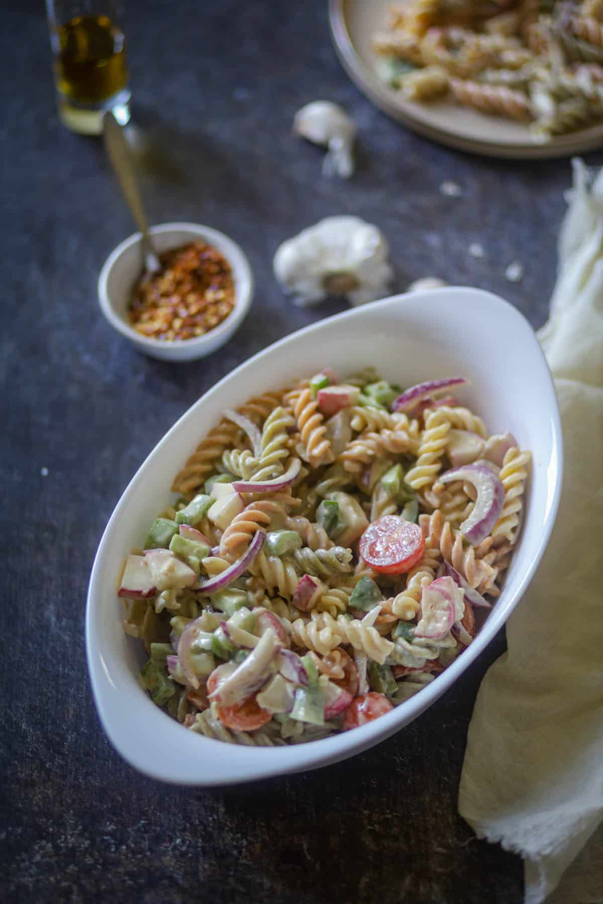 Tricolor Pasta served with some red chili flakes.