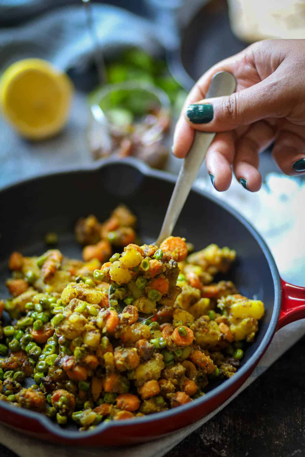 A spoonful of aloo gajar matar.