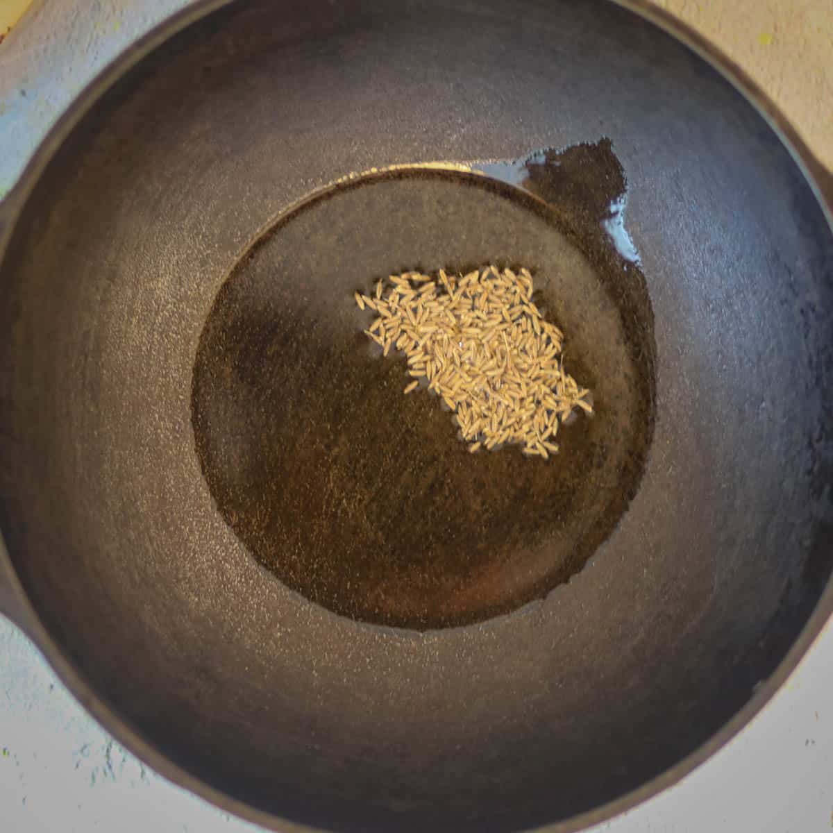 Add cumin seeds in hot oil.