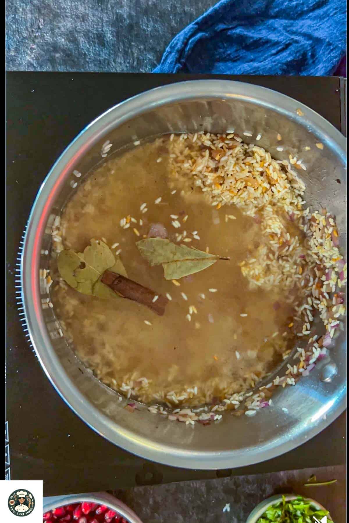 Image of steel pot with water, whole spices nad salt.