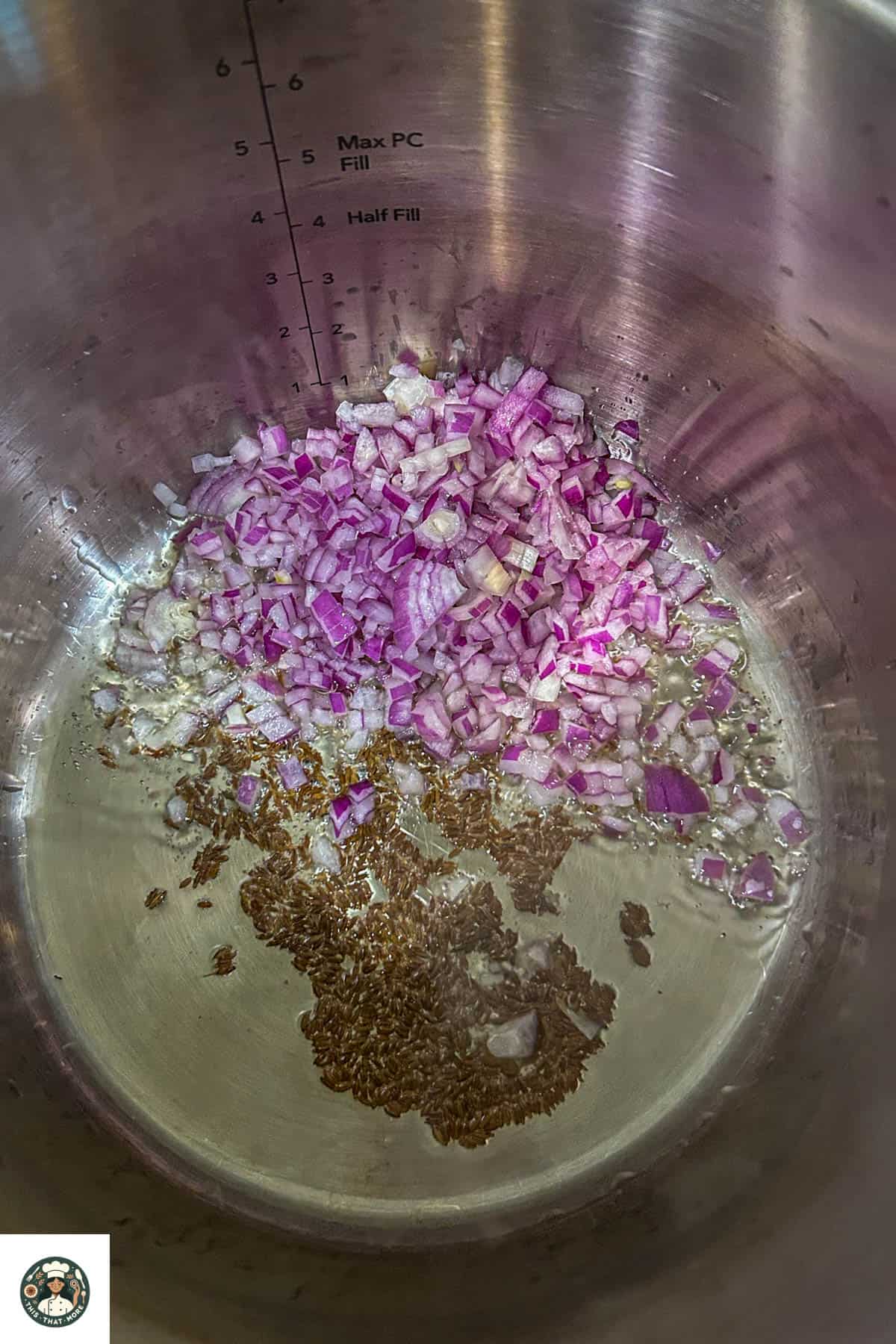 Overhead shot of sauteeing of onions in a pot.