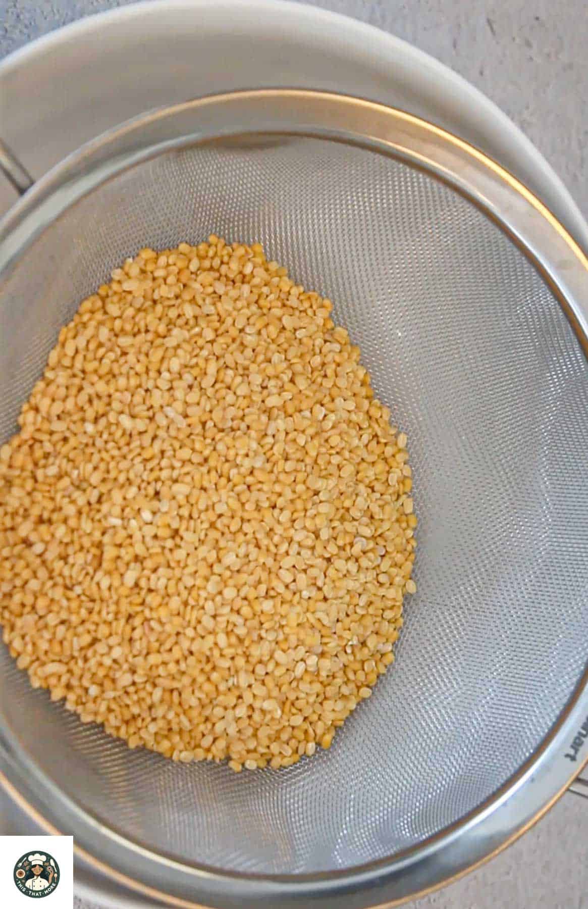 Image of urad dal and moong dal added in a bowl.