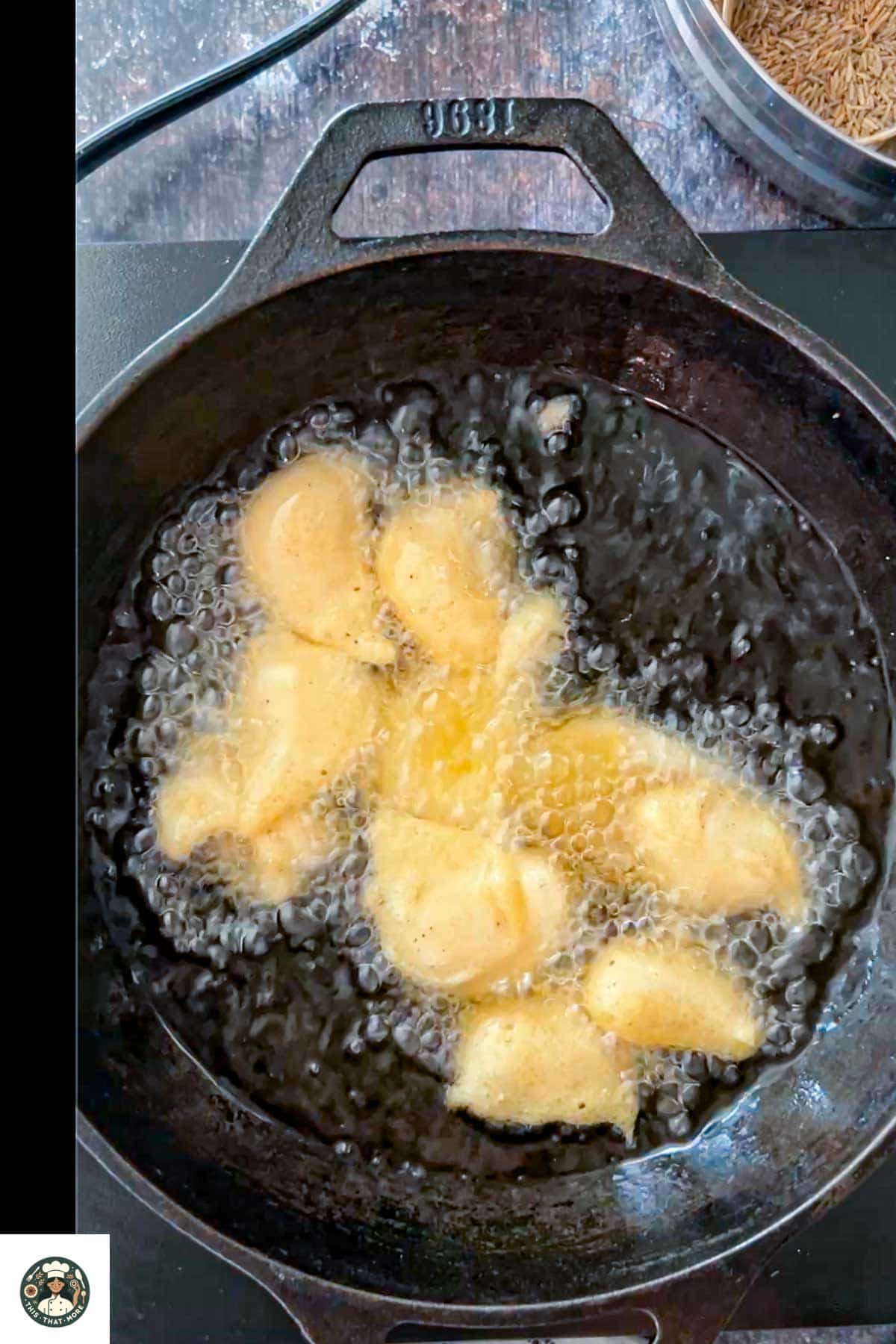 Image showing lentil fritters added to hot oil.