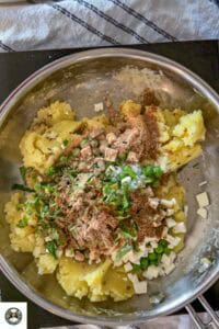 Add peas, paneer, cilantro, spices, and green chili and mix until well combined.