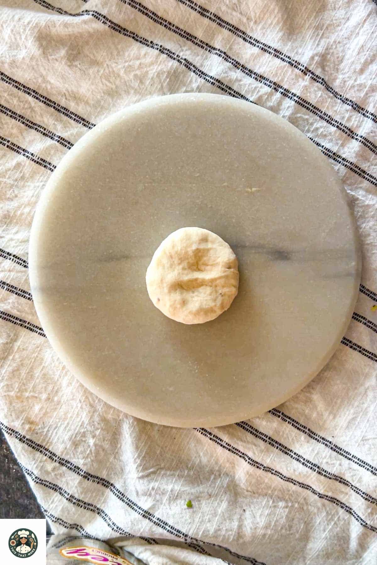 Take a small amount of dough and then roll it into a ball shape.