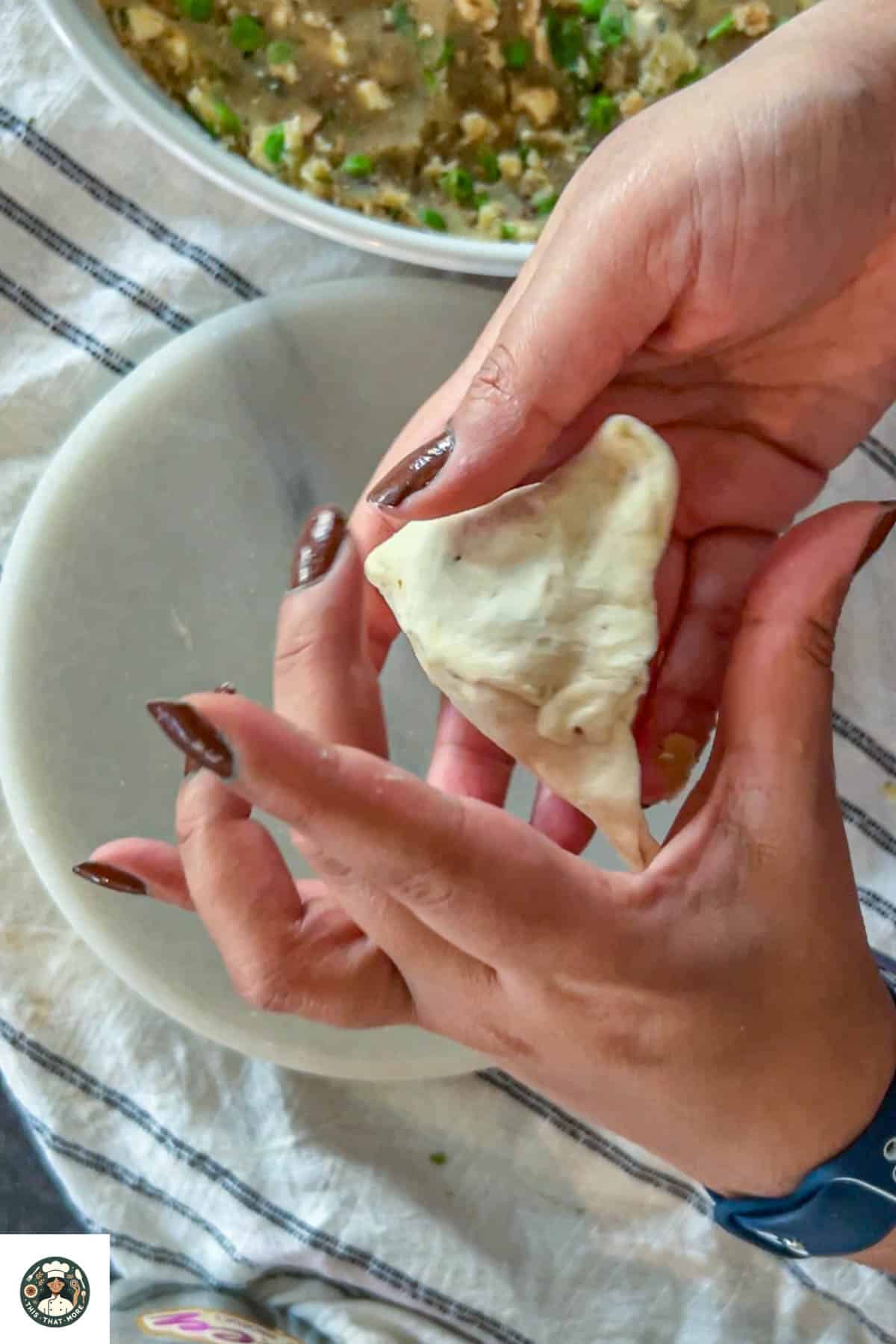 Seal all the sides to form a samosa shape.