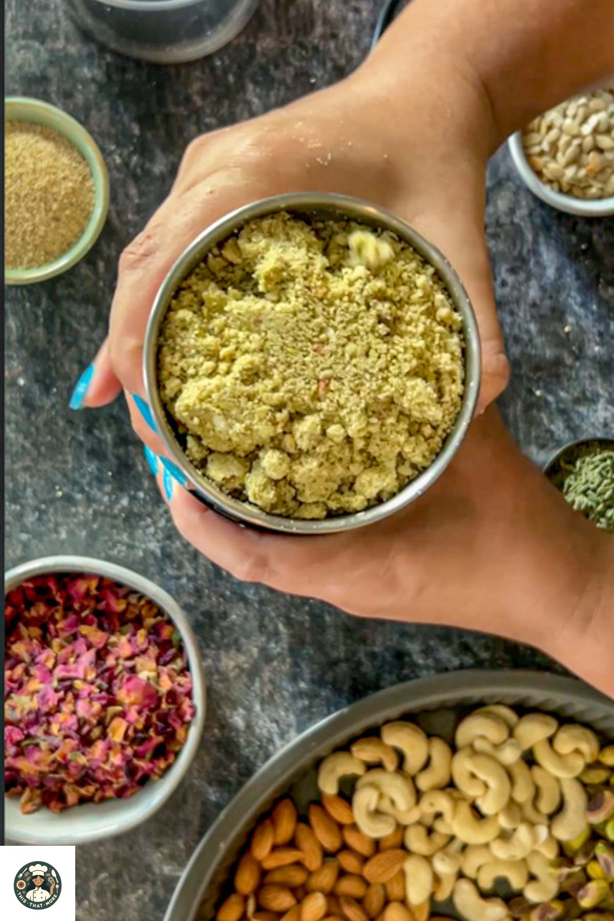 Blended nuts powder in the spice grinder, holded in hand.