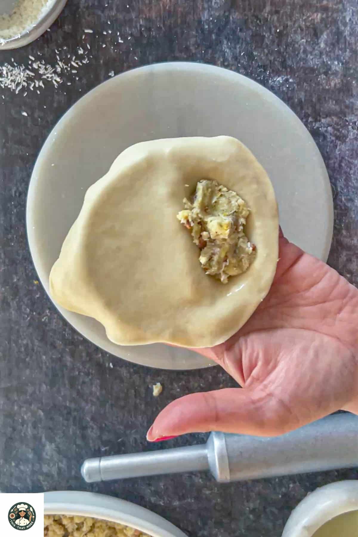 Image showing stuffing added to the rolled dough.