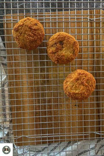 Once the tikkis turn golden-brown from both sides, remove it from the frying pan. Place them on a slotted tray.